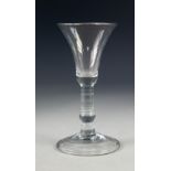 ANTIQUE WINE GLASS, with bell shaped bowl, knopped, cylindrical stem and conical, folded foot,