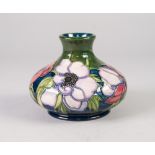 A MODERN MOORCROFT POTTERY SQUAT BALUSTER SHAPE VASE, tube lined with flowers, impressed marks,