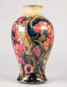 A GOOD INTER-WAR YEARS WILLIAM MOORCROFT POTTERY INVERTED BALUSTER SHAPE VASE, tube-lined with brick