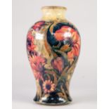 A GOOD INTER-WAR YEARS WILLIAM MOORCROFT POTTERY INVERTED BALUSTER SHAPE VASE, tube-lined with brick