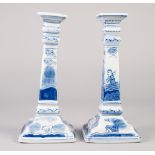 PAIR OF MODERN BLUE AND WHITE PORCELAIN CANDLESTICKS, of square form, outlined and washed in the