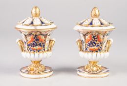 A PAIR OF EARLY NINETEENTH CENTURY DERBY PORCELAIN 'JAPAN' DECORATED TWO HANDLED CAMPANA SHAPE POT
