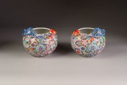 A PAIR OF CHINESE LATE QING DYNASTY PORCELAIN COMPRESSED GLOBULAR VASES, decorated autour with '