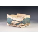 HEAVY STUDIO POTTERY BOWL, of shallow oblong, slab sided form, glazed in blue on an off-white