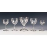 FIVE ANTIQUE DRINKING GLASSES, comprising: a RUMMER, with engraved ribbon tied swagged border to the