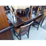 A DRAW-LEAF DINING TABLE