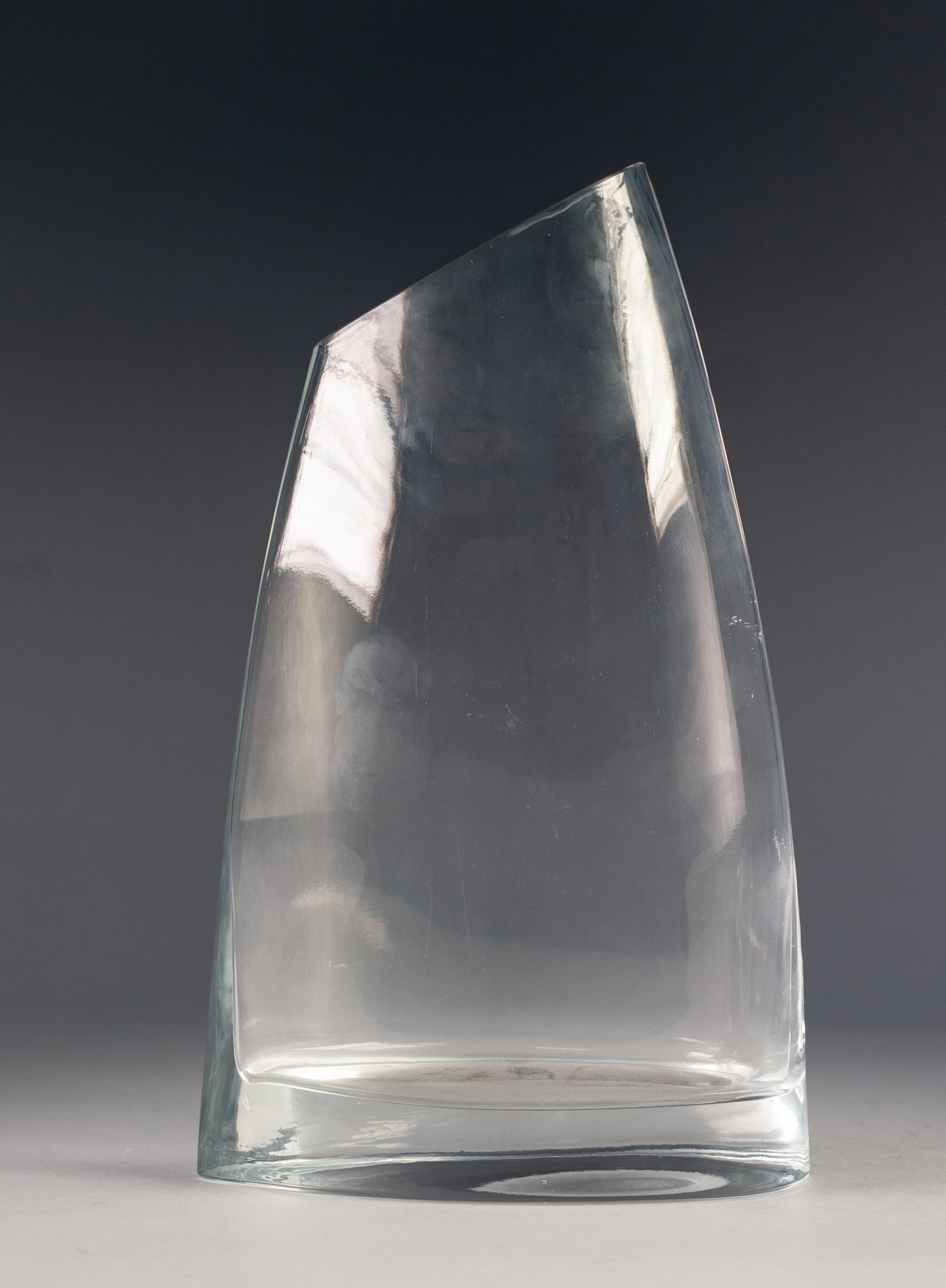 1970's CLEAR GLASS VASE, IN THE MODERNIST STYLE, OF SLIGHTLY FLATTENED, TAPERING FORM WITH SOLID