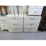 A PAIR OF WHITE MELAMINE THREE DRAWER CHESTS OF DRAWERS AND A PAIR OF WHITE FINISH BEDSIDE CHESTS OF