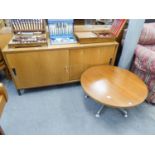 TEAK 'PROJECT' SIDEBOARD HAVING TWO SLIDING DOORS AND A CIRCULAR TOPPED COFFEE TABLE ON FIVE