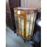 WALNUTWOOD SINGLE DOOR DISPLAY CABINET WITH ORIENTAL DECORATION AND CLOCK INSERT