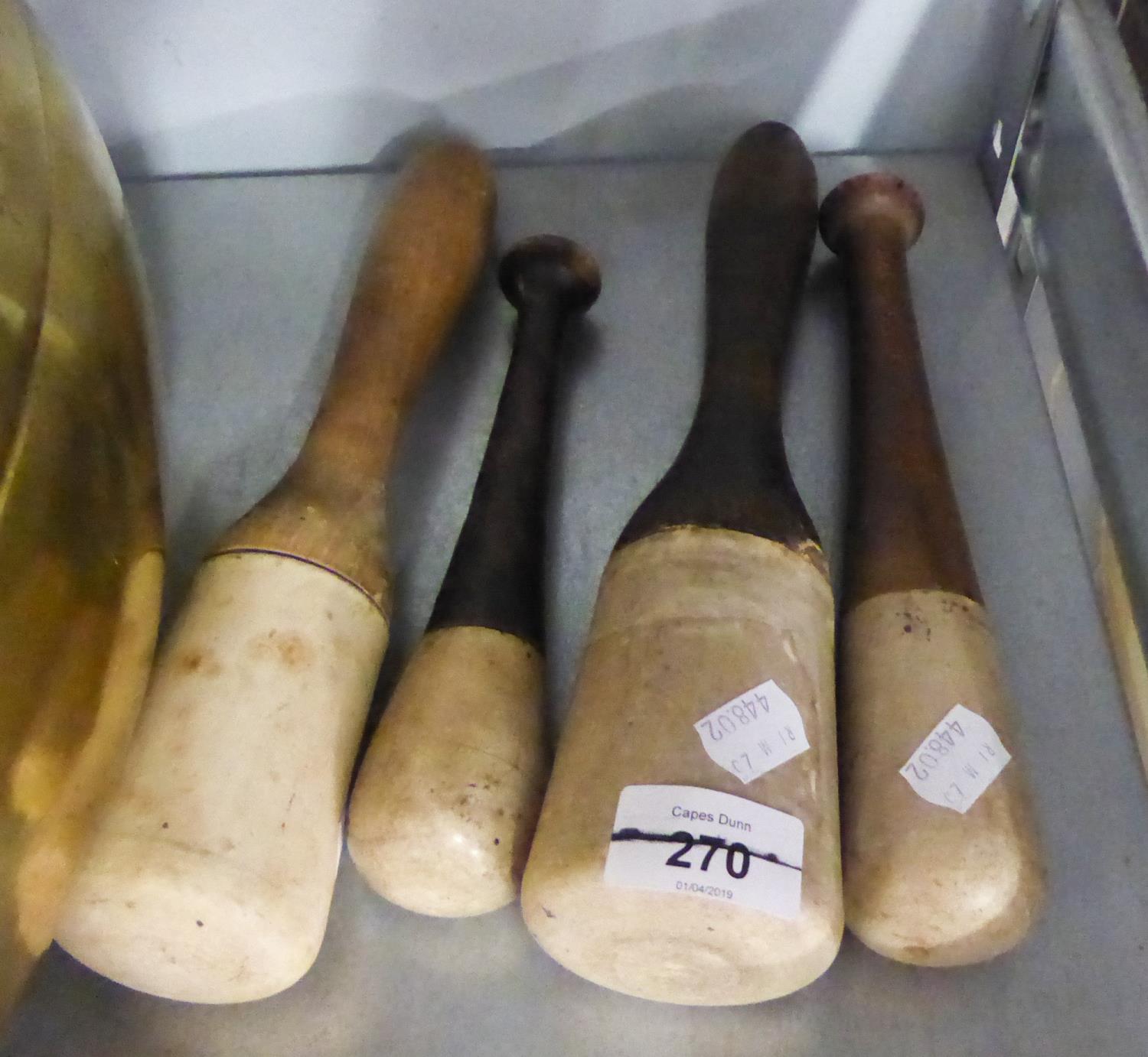 THREE WEDGWOOD PESTLES WITH WOODEN HANDLES AND ANOTHER (4)