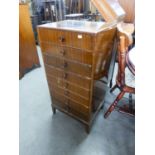 A MID TWENTIETH CENTURY MUSIC CABINET WITH FALL FRONT DRAWERS