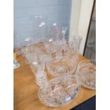 LARGE QUANTITY OF CUT GLASS BOWLS AND VASES TO INCLUDE A 'STUART' BOWL, CANDLEHOLDERS ETC.....