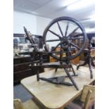 AN ANTIQUE LARGE SPINNING WHEEL