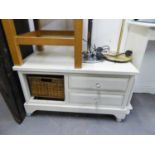 A WHITE FINISH COFFEE TABLE WITH TWO DRAWERS AND A WICKER BASKET