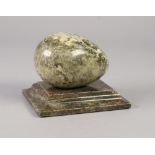 GREEN ONYX EGG ON OBLONG STAND PAPERWEIGHT