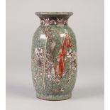 ORIENTAL CRACKLE GLAZED POTTERY VASE, of ovoid form, applied in white with skeletons, on a celadon