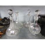 A GLASS CLARET JUG, TWO SHIPS DECANTERS AND A GLOBE DECANTER (4)