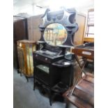 TALL EBONISED CARVED DISPLAY CABINET WITH OVAL MIRROR TO TOP SECTION, GLAZED DOOR ALONG SIDE