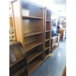 A 6'4" PINE OPEN BOOKCASE WITH ADJUSTABLE SHELVES AND A MATCHING NARROW BOOKCASE (2)