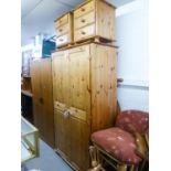 A PINE TWO DOOR WARDROBE AND A PAIR OF THREE DRAWER BEDSIDE CABINETS (3)