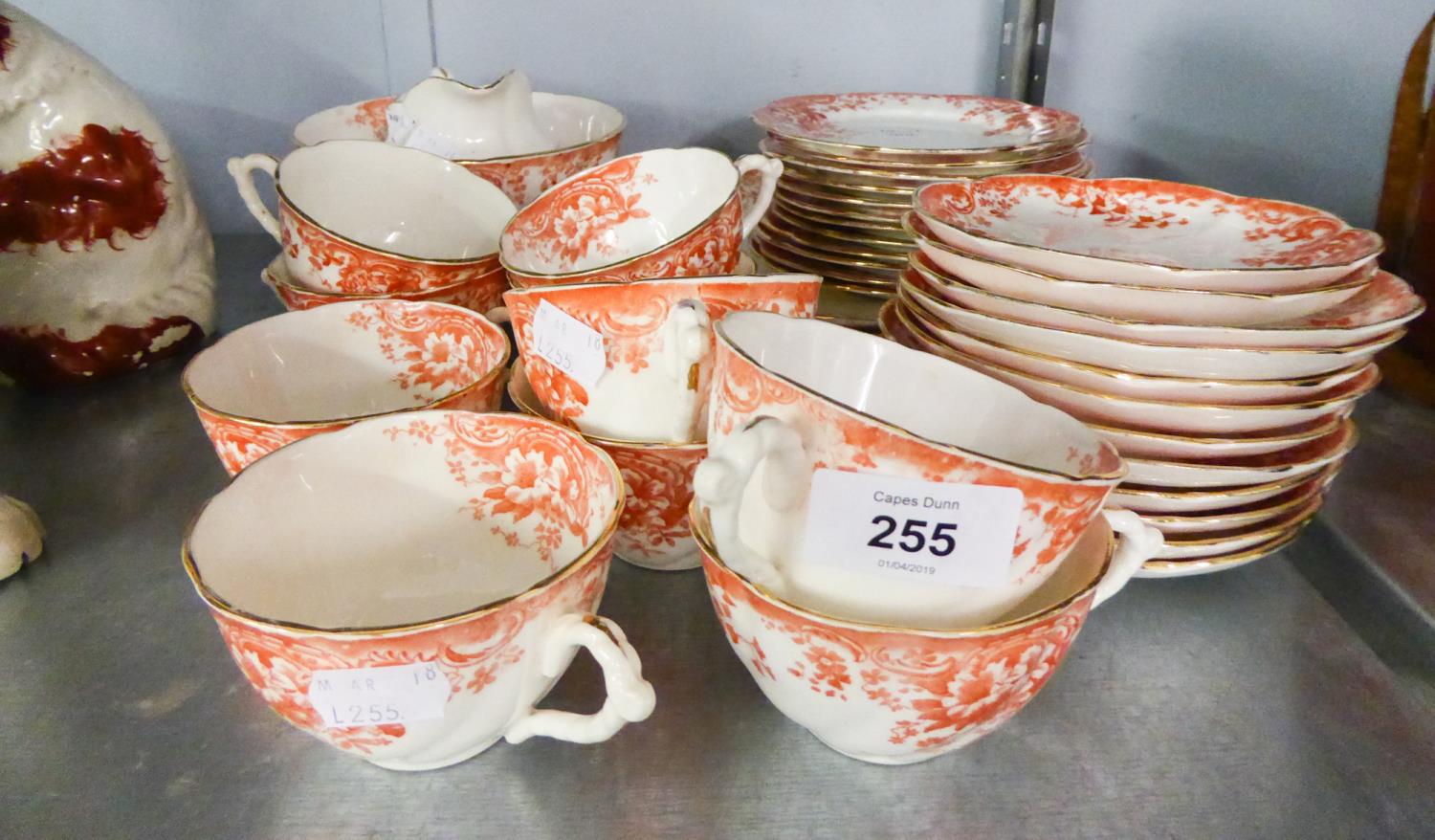 A 38 PIECE LATE VICTORIAN PORCELAIN TEA SERVICE, TRANSFER PRINTED IN BRICK RED (38)