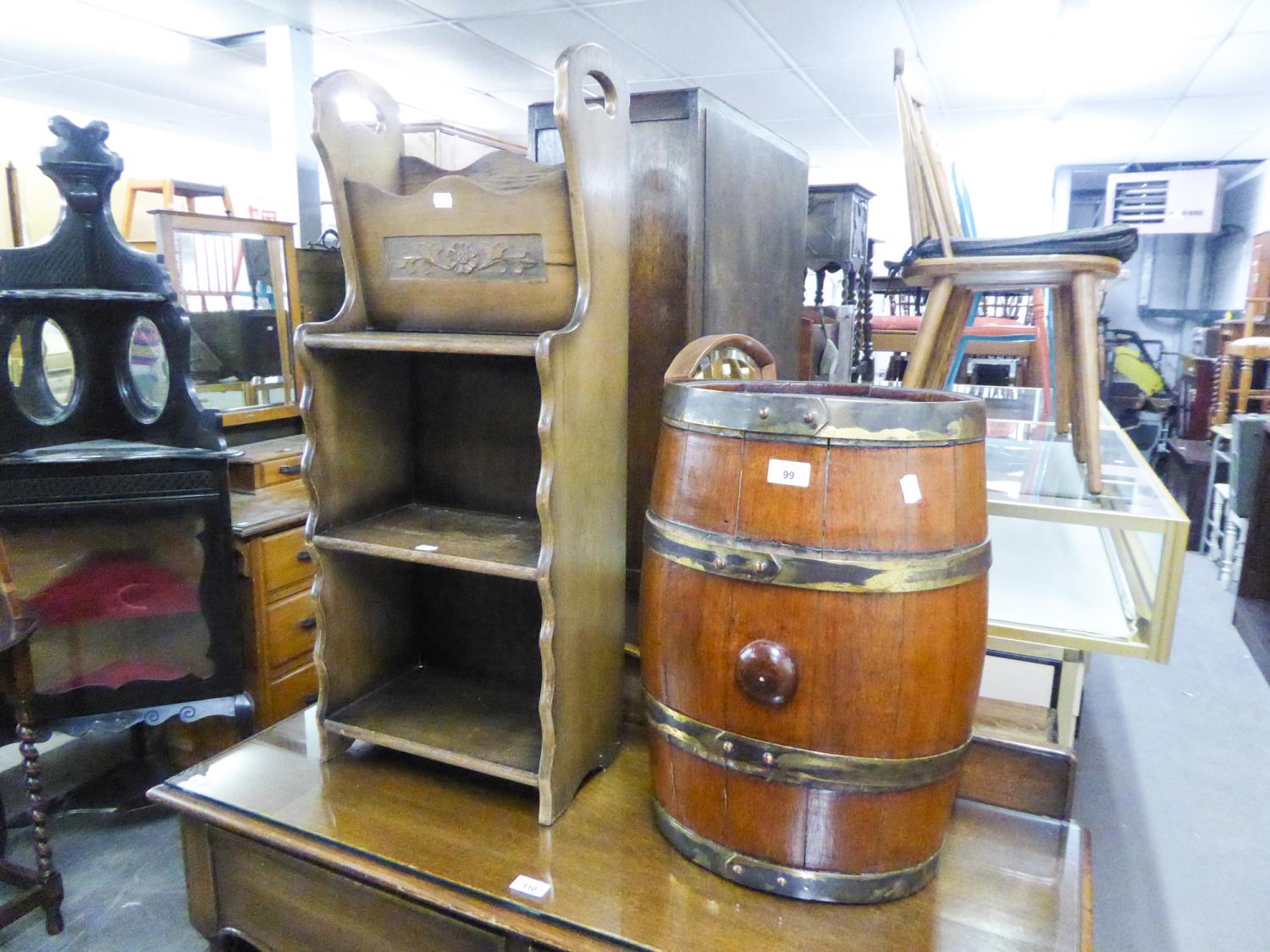 A COOPERED WOODEN METAL HOOPED BARREL, ALSO A FLOOR STANDING OPEN BOOK/MAGAZINE STAND (2)