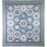 PATCHWORK QUILTED FABRIC PANEL, worked in colours on a blue ground, 26” x 24” (66cm x 61cm),