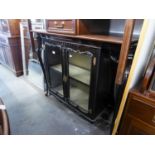 A VICTORIAN DISPLAY CABINET WITH TWO GLAZED CENTRAL DOORS, FLANKED BY TWO OPEN SECTIONS WITH OVAL