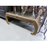 A SOUTH EAST ASIAN CARVED OBLONG COFFEE TABLE