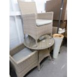 A BASKET WEAVE FOUR PIECE CONSERVATORY SUITE OF THREE CHAIRS AND A CIRCULAR TABLE WITH LOOSE GLASS