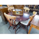 A MODERN CIRCULAR BREAKFAST TABLE AND FOUR MATCHING CHAIRS