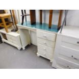 A WHITE PAINTED PINE SINGLE PEDESTAL DRESSING TABLE, WITH FOUR DRAWERS ON BUN FEET, A PAIR OF GREY