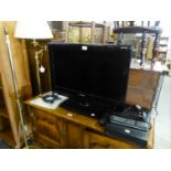 A PHILLIPS 26" FLAT SCREEN TV. AND A FREEVIEW PLAYER (2)