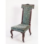 A VICTORIAN ROSEWOOD FRAMED TALL BACK PRIE-DIEU TYPE CHAIR, the padded back flanked by spiral