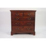 GEORGE III OAK CHEST OF DRAWERS, the moulded oblong top above two short and three long oak lined and