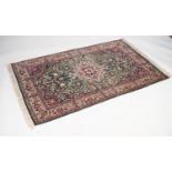 PERSIAN KERMANSHAH RUG with lobed cream and floral medallion, with pendants on a blue field,