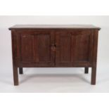 ANTIQUE OAK COMPOSITE CUPBOARD, the moulded oblong top above a pair of twin panelled cupboard doors,