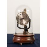 AN EARLY TWENTIETH CENTURY ELECTRO-MAGNETIC 800 DAYS CLOCK, beneath a glass dome