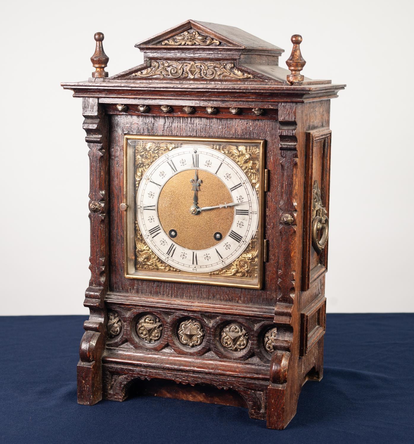 LENZKIRCH, LATE NINETEENTH CENTURY BRASS MOUNTED OAK MANTLE CLOCK, the 5 1/2" brass dial with