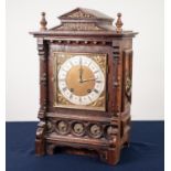 LENZKIRCH, LATE NINETEENTH CENTURY BRASS MOUNTED OAK MANTLE CLOCK, the 5 1/2" brass dial with