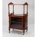 MID VICTORIAN BURR WALNUT AND CARVED MUSIC CANTERBURY WHAT-NOT, the rounded oblong top surmounted by