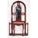 LATE VICTORIAN MAHOGANY HALL STAND, the arched back with nine pegs and central mirror, set above a