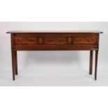 GEORGE III STAINED DEAL DRESSER BASE, the moulded oblong top with canted fore corners, set above