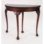 GEORGIAN STYLE CARVED MAHOGANY DEMI-LUNE CARD TABLE, the fold-over top with moulded egg and dart