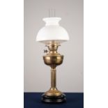 VICTORIAN BRASS COLUMN PATTERN OIL TABLE LAMP, with white glass shade and circular black base,