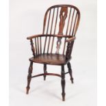 NINETEENTH CENTURY ELM AND OAK HOOP BACK WINDSOR ARMCHAIR, the two part spindle back with pierced