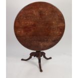 GEORGIAN OAK TILT TOP OCCASIONAL TABLE, the circular top above a vase shaped, turned column, and