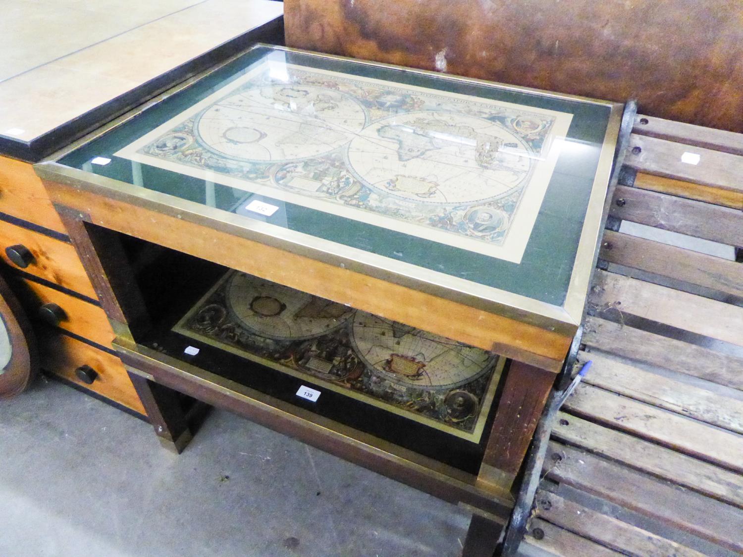 A MAHOGANY LARGE RECTANGULAR COFFEE TABLE, THE BRASS FRAMED GLAZED TOP ENCLOSING A REPRODUCTION OF