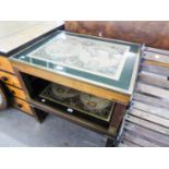 A MAHOGANY LARGE RECTANGULAR COFFEE TABLE, THE BRASS FRAMED GLAZED TOP ENCLOSING A REPRODUCTION OF